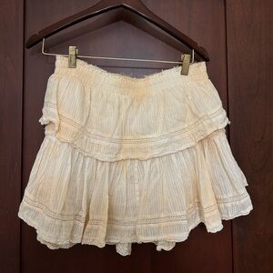 LOVESHACKFANCY Ruffle Mini Skirt in the color sun tan glow